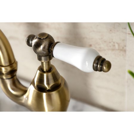 Kingston Brass Bridge Bathroom Faucet with Brass PopUp, Antique Brass KS7973PL